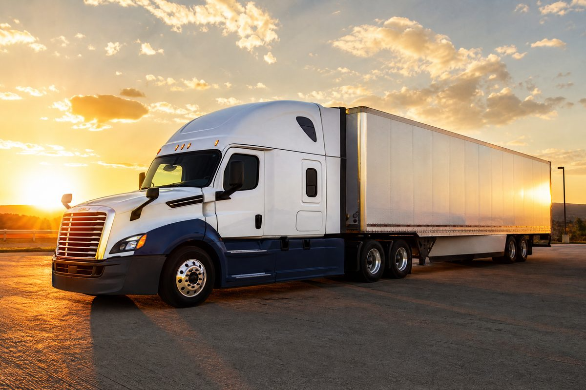 Late-model Class 8 semi truck at sunset